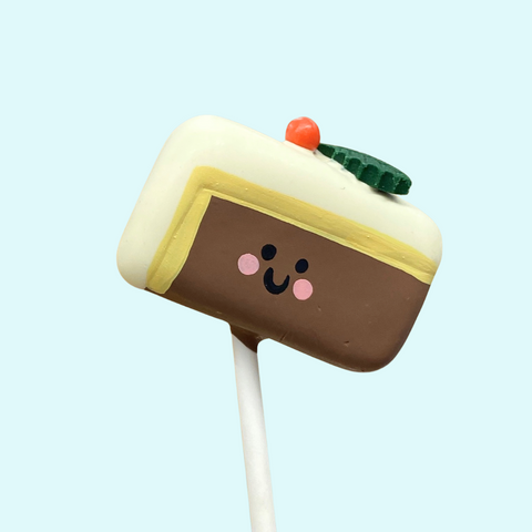 Handmade Christmas cake pop shaped like a mini Christmas cake. 
Front 