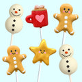 Handmade Christmas cake pops including snowman, gingerbread man, festive star and hot chocolate mug from PopBakery.