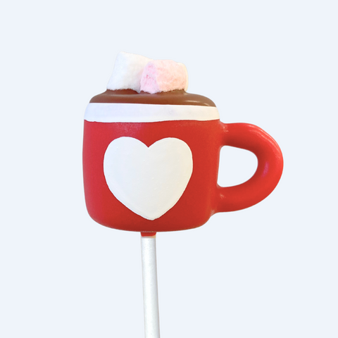 Christmas hot chocolate mug cake pop decorated with tiny marshmallows.