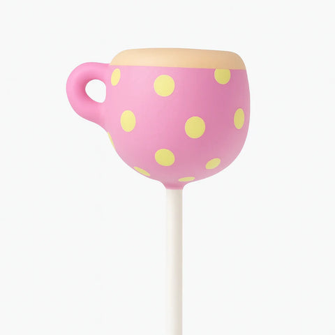 Whimsical tea party cup cake pop with decorative candy melt design
