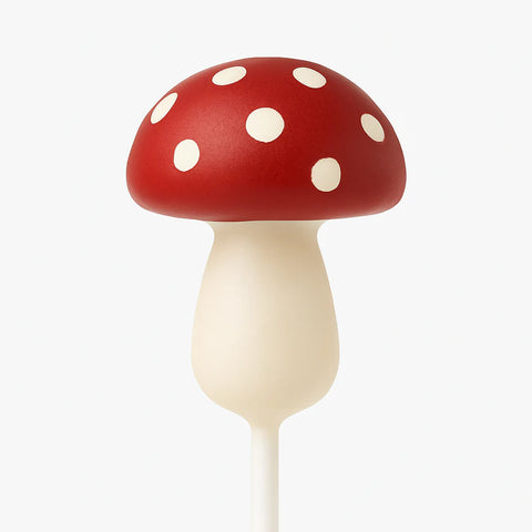 Magic mushroom cake pop with colourful candy melt and playful design.