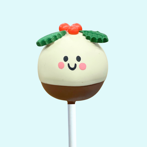 Festive Christmas cake pop shaped like a smiling pudding.