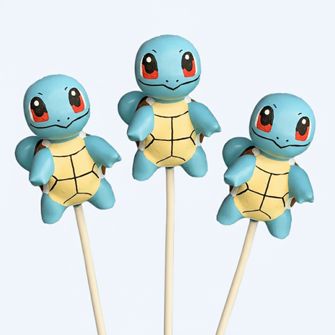 Hand-sculpted blue shell buddy creature cake pop with full character body.