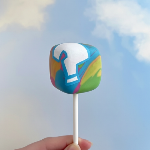 Mystery block cake pop with colourful geometric design and candy melt coating