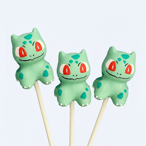 Hand-sculpted leafy sprout creature cake pop with full character body.