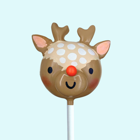 Reindeer Christmas cake pop with red nose and antlers.