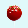 Handmade red Christmas sprinkle cake pop with festive sprinkles.