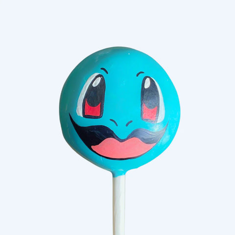 Blue shell buddy creature cake pop with hand-sculpted 3D head.